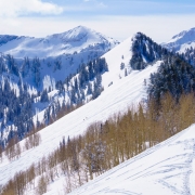 Skiier hiking up the ridge towards the back of Silver Fork.