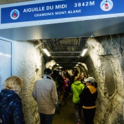 At the station at the top.  The tunnel bores through the peak and to a bridge between the two pinnacles that make up the Aiguille du Midi.