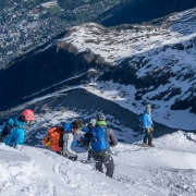 FX having a blast with the tiny town of Chamonix in the background.  Belcourt leading the way.