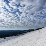 Picturesque cotton ball clouds for the approach.