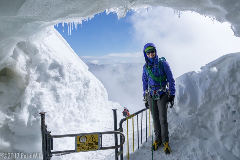 Carly at the mouth of the ice cave that leads down the infamous knife edge snow/ice ridge from the Aiguille du Midi.