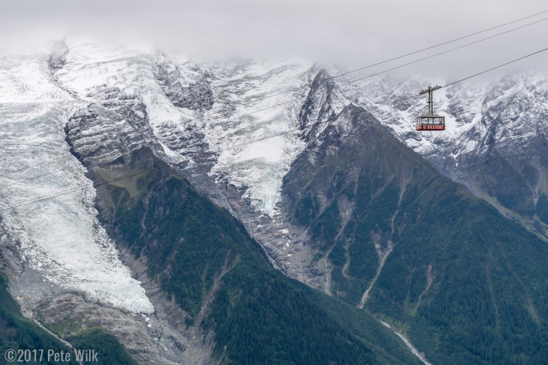 An empty Brevent cable car going back down to the midstation at the Planpraz.  The Aiguille du Midi side is across the valley.