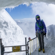 Carly at the mouth of the ice cave that leads down the infamous knife edge snow/ice ridge from the Aiguille du Midi.