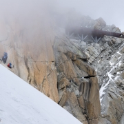 The beginnings of the turn in weather and in fluidity of the climbing.  The Russian team of three is about to create a traffic jam.  Note that there\'s still a fair amount of climbing before getting to the platform.