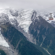 An empty Brevent cable car going back down to the midstation at the Planpraz.  The Aiguille du Midi side is across the valley.