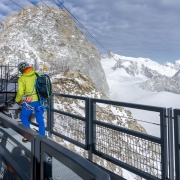Maxime leading the way out of the Italian Skyway telepherique.  The Aiguille du Midi is across the glaciers in the distance.  The cables for the Helbronner go across to that side without supports.