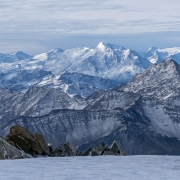 Dramatic lighting and mountain ranges on the Italian side.