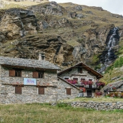 Beautiful house along the road.  Many of the houses in the area had this style of stone roof.  I bet that waterfall ices up nicely in the winter.