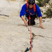 Giovanni going up the great finger crack on Racing Lizards (5.7).