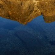 Reflections of water and mountains.