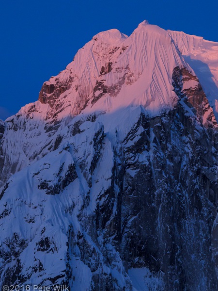 Early rays of the sun highlighting the fluting on Mt. Wake.