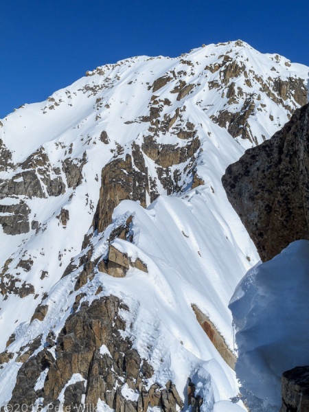 The rest of the ridge we didn't do.  At this point there's an overhung rock face topping out onto an unknown height snow mushroom.