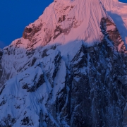 Early rays of the sun highlighting the fluting on Mt. Wake.