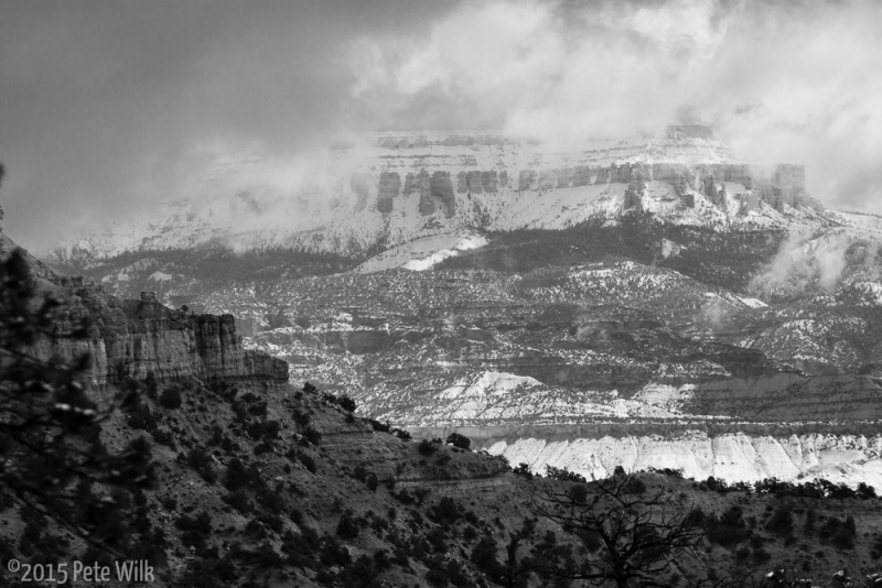 The distant mountains had more snow all day.