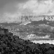 The distant mountains had more snow all day.