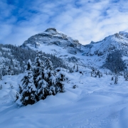 View of Mt. Sir Donald (left of center), and Perly Rock (well right).  Our ski line was from just off frame to the right, down to the right of the icy cliff band capped by 4 large pines.