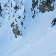 Snowboarder dropping into the Cirque.