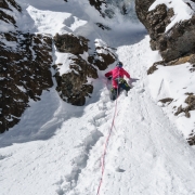 Carly slogging up to meet the short bit of ice on a moderate route.