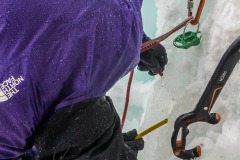 Since this line rarely forms the anchors were choss.  At this station, the first ledge, there was a single bolt in a commically chossy wall behind the pillar.  Brushing agains it dislodged rocks.  We opted for a v-thread to rap.