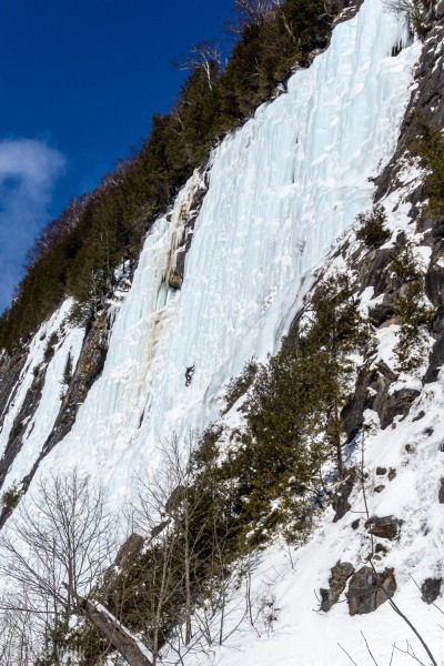 Climber for scale on the massive sun drenched ice falls of the Lake.