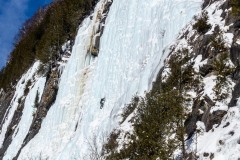 Climber for scale on the massive sun drenched ice falls of the Lake.