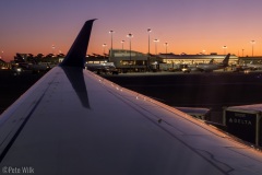 Sitting on the plane watching the alpenglow at Logan Airport.