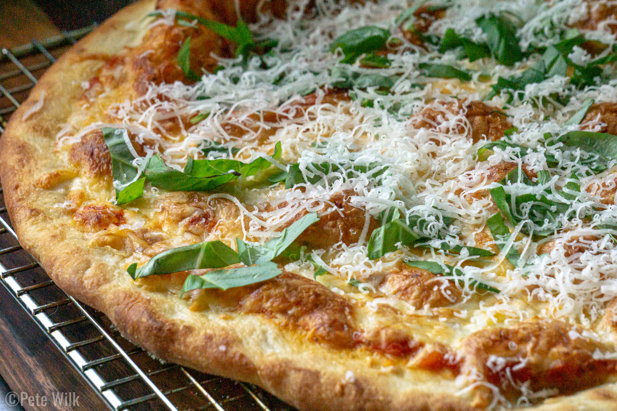 We've got a new pizza dough recipe and it is amazing.  Another trick we've learned is getting the stone almost all the way to the top of the oven.