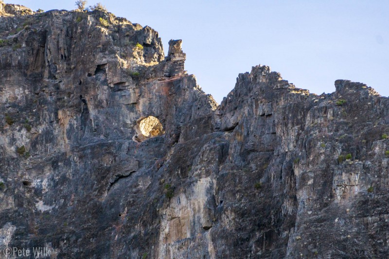 View of Eye of the Needle (5.10) from the spot we camped.  The route ends after going through the hole and climbing the farside to to the block above and right of the hole.