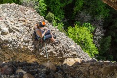 Carly at the top of P1 of the 3 pitch route called Exit Wound (5.10b).