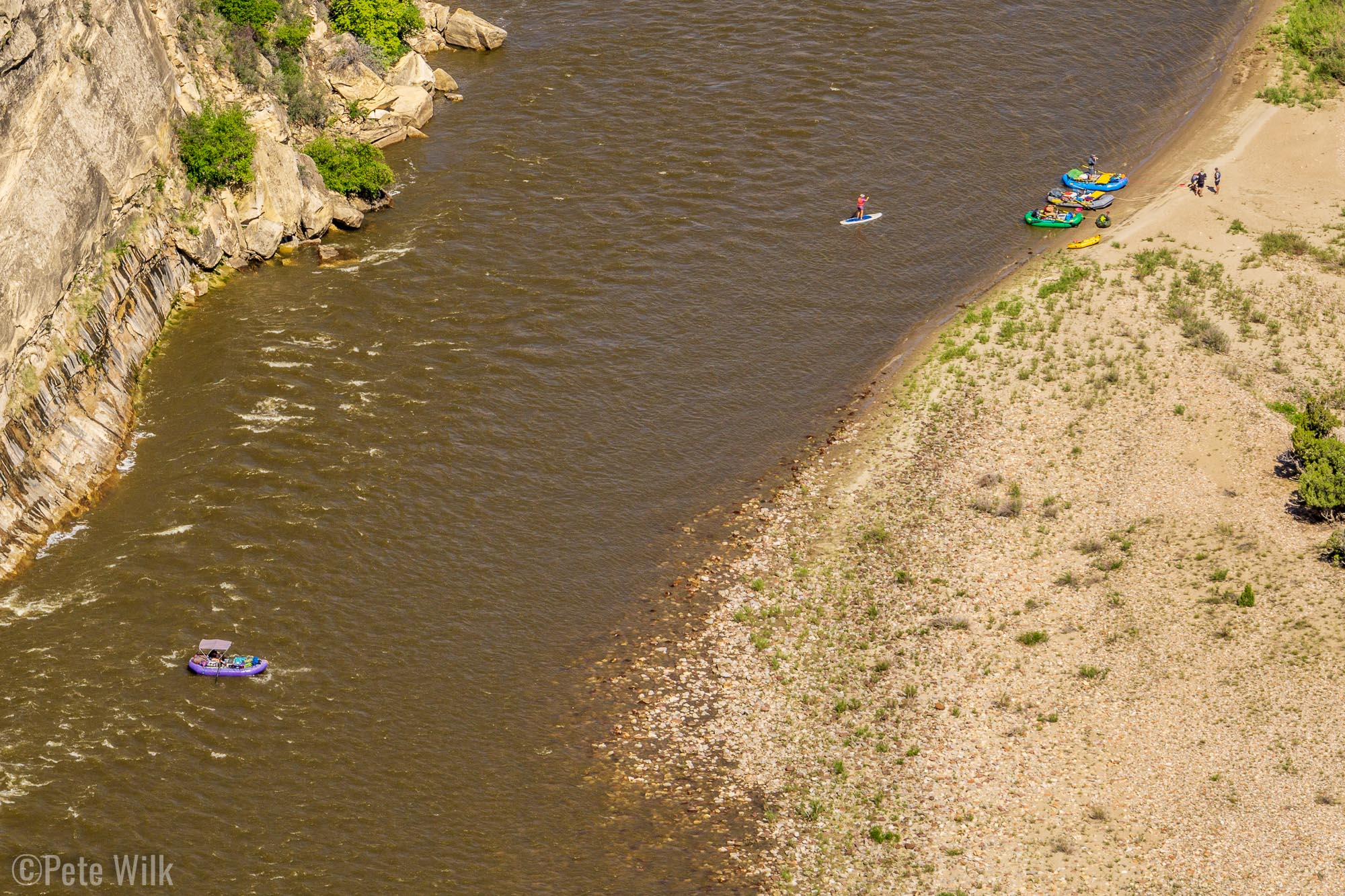 Looking down from high on the rim to rafters floating the Yampa River.