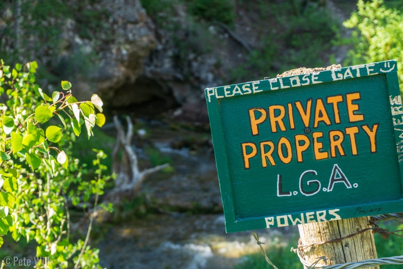 The Hole-in-the-Rock apparently is on private grazing land, but the owners don't mind if you take a look provided you keep the gate closed.