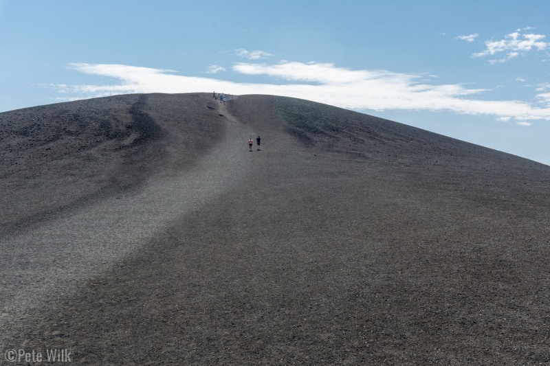 The trail up the cinder cone.  The whole pile is basically made of pea and marble sized rocks.  It formed when a fountain of magma sprayed into the air and this is the cooled and hardened magma.