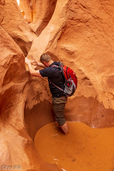 The second crux of the Peek-a-boo Slot Canyon.  The first was a sandy slopey entrance.  This was the only water we needed to get into.