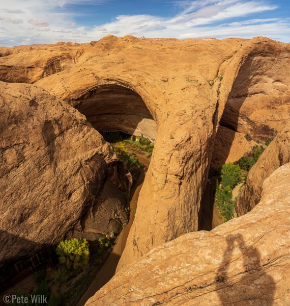 View from the rim looking down about 250' to the top of Jacob Hamblin's Arch.  The other amphitheater is on the left.