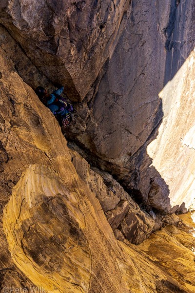 In the shade behind the big pillar that is 3/4 up the route.