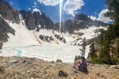 We got up to the lake below Thompson Peak, on the right.  The lake was still frozen.  It was also peculiar in that it had no surface outlet and must only drain through cracks in the rocks.  It was sort of naturally dammed.