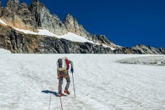 Sharkfin Tower is the one above Micah's head in the center.  There's a pitch or two off the glacier then a snowfield then back onto the rock.