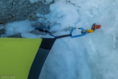 Anchor at one corner of the tent to keep it on our platform.