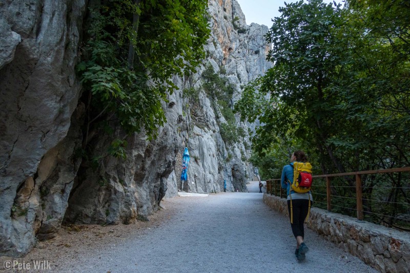 Heading up the main trail into Paklenica National Park.  There's single pitch climbing along the left and more multipitch on the right.  The souvenier/ice cream shop hasn't at the umbrella hasn't opened yet this morning.