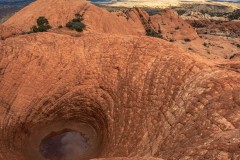 The Vortex is a cool depression in a sandstone ridge that appears to not have an outlet.  I assume it formed via wind erosion.