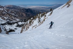 Kate heading into the West Twin.  Any appearance of good snow is an optical illusion.