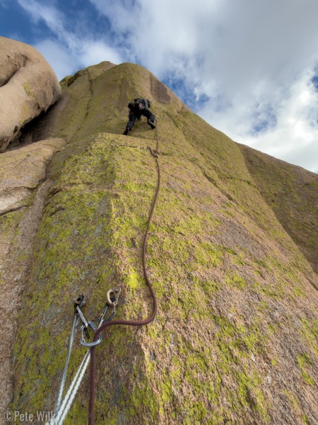 Andreas heading up a classic lichen covered slab.