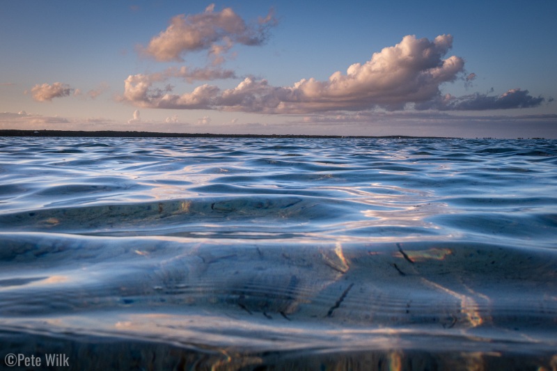 Sun, puffy clouds, clear  water, and beautiful light.  What else do you need for a pretty scene?