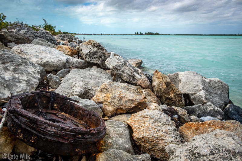 A rusted out car rotor on the causeway.
